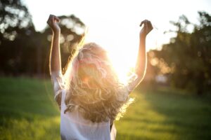 Girl in a background enjoying under the sun